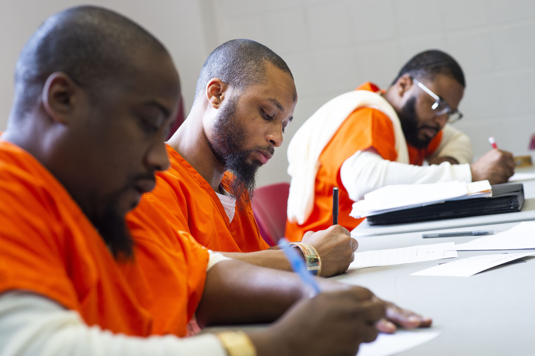 Adult learners participating in an education class in a correctional setting