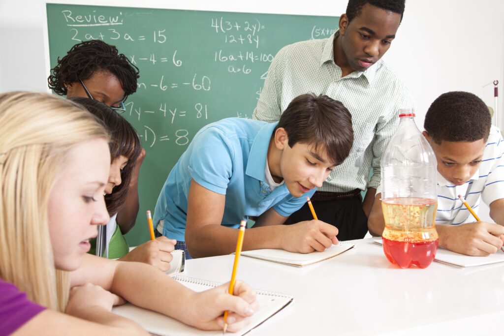 Students collaborating on a math activity at a classroom table